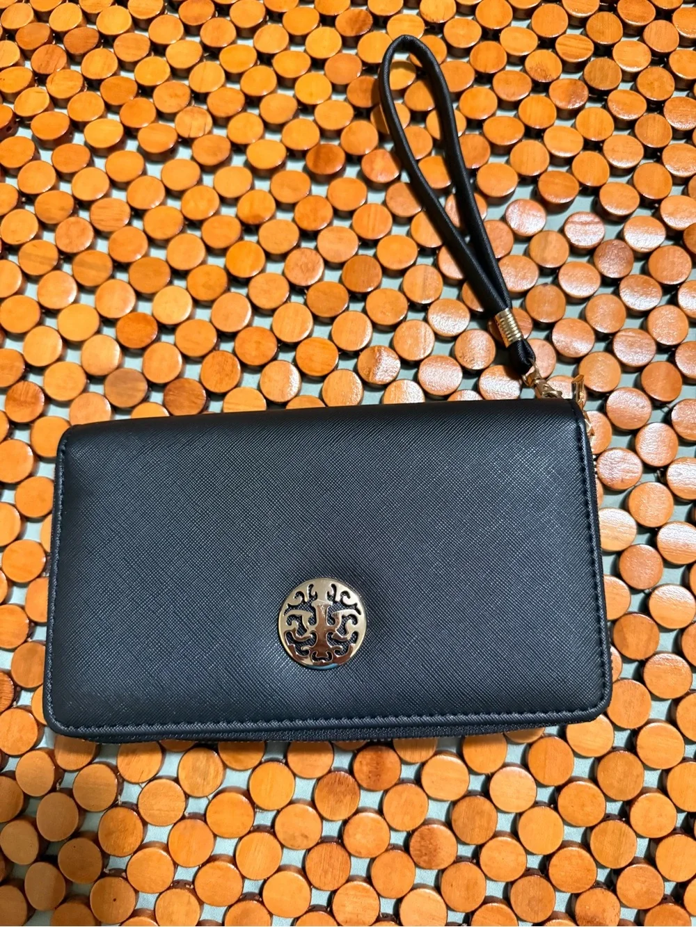 Classic Black Wristlet Clutch with Decorative Gold Emblem